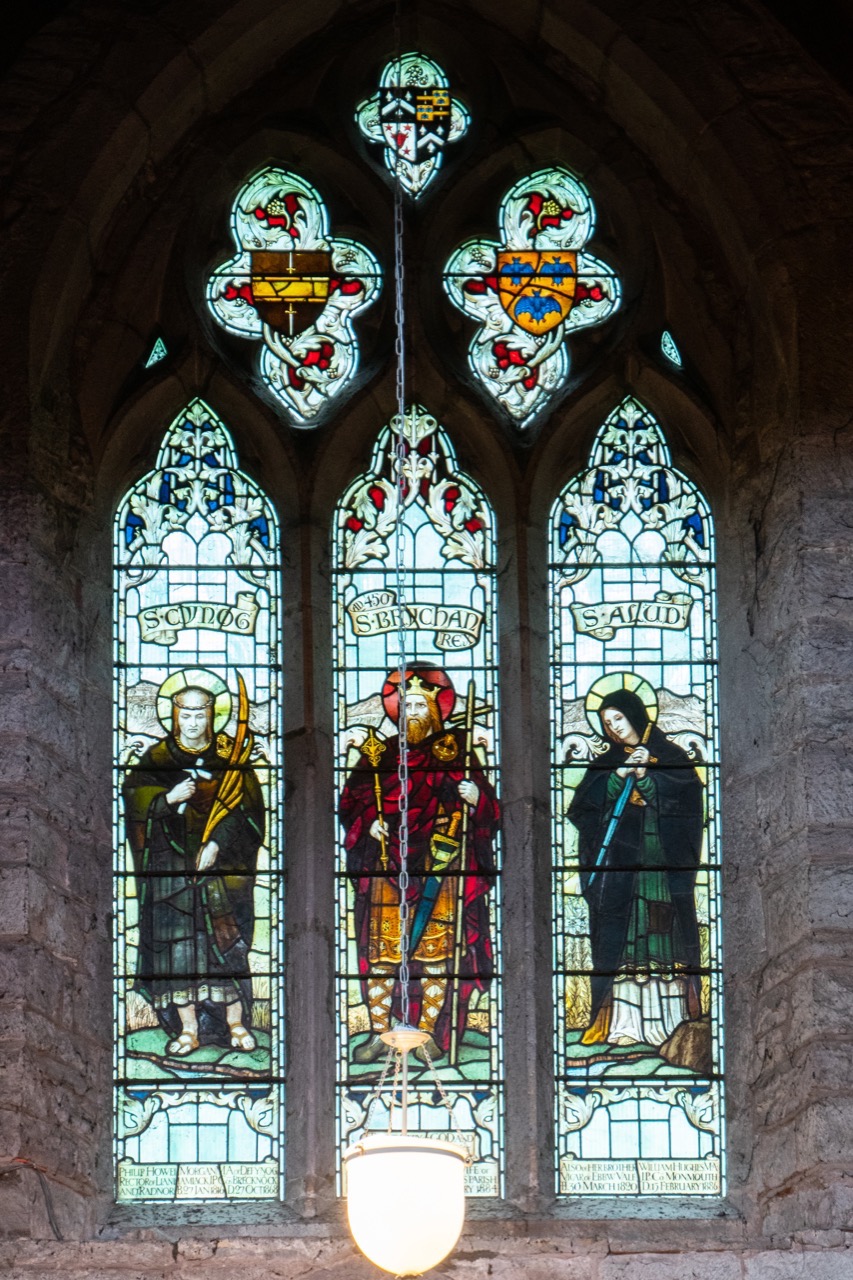 Stained glass windows in the north wall showing the Welsh saints Cynog, Brychan and Alud