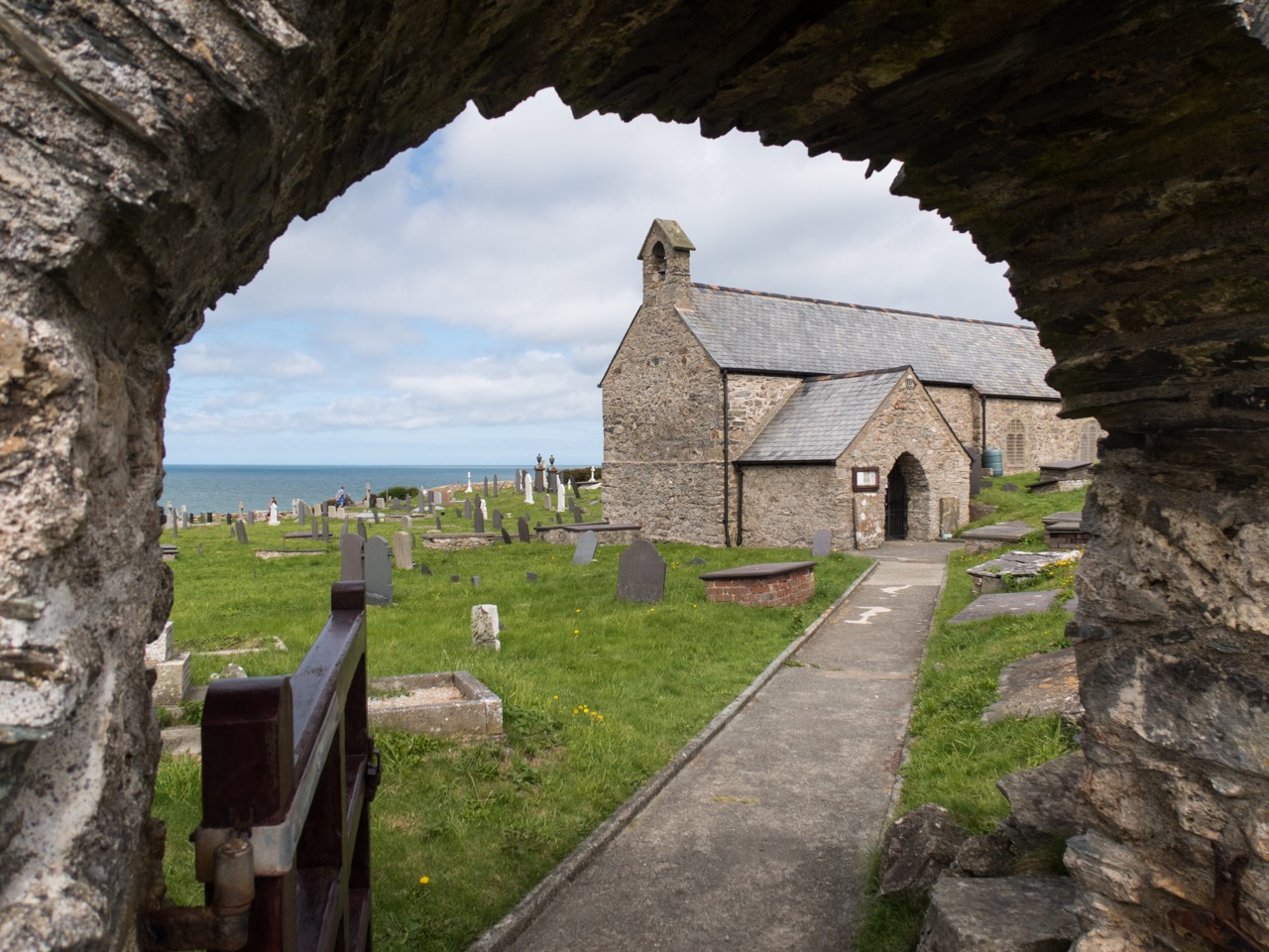 Peeking through the churchyard gate