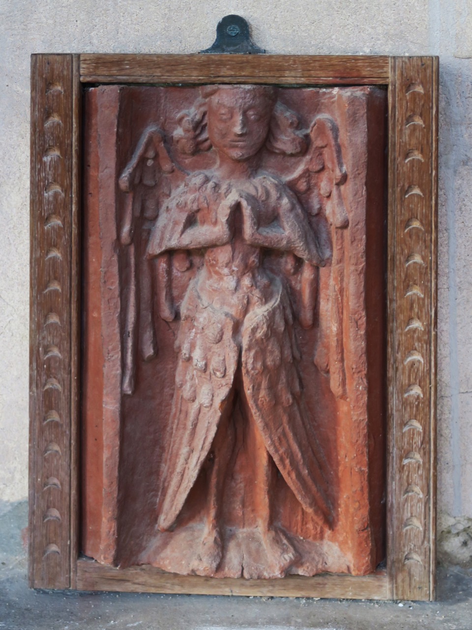 Angel figure on brick