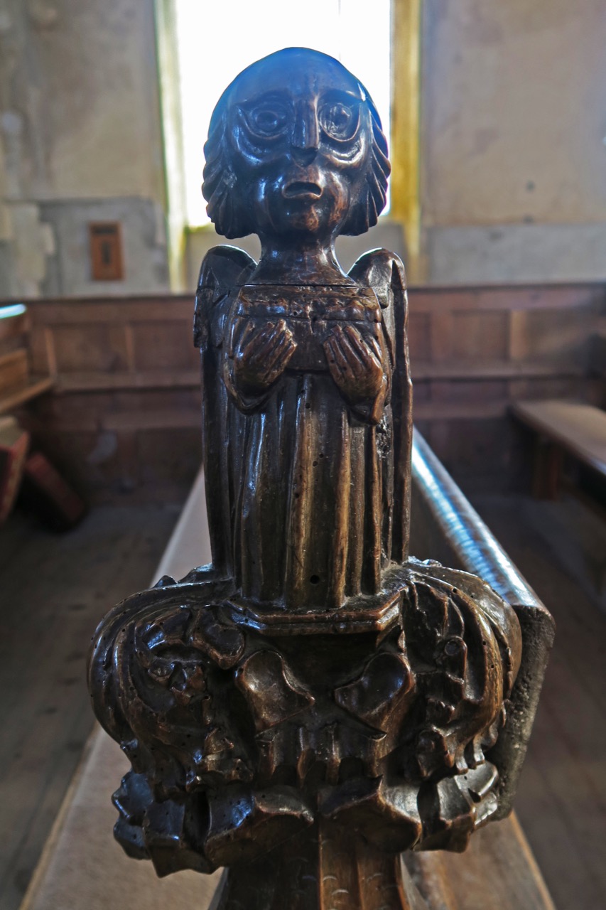 Bench end with poppy head
