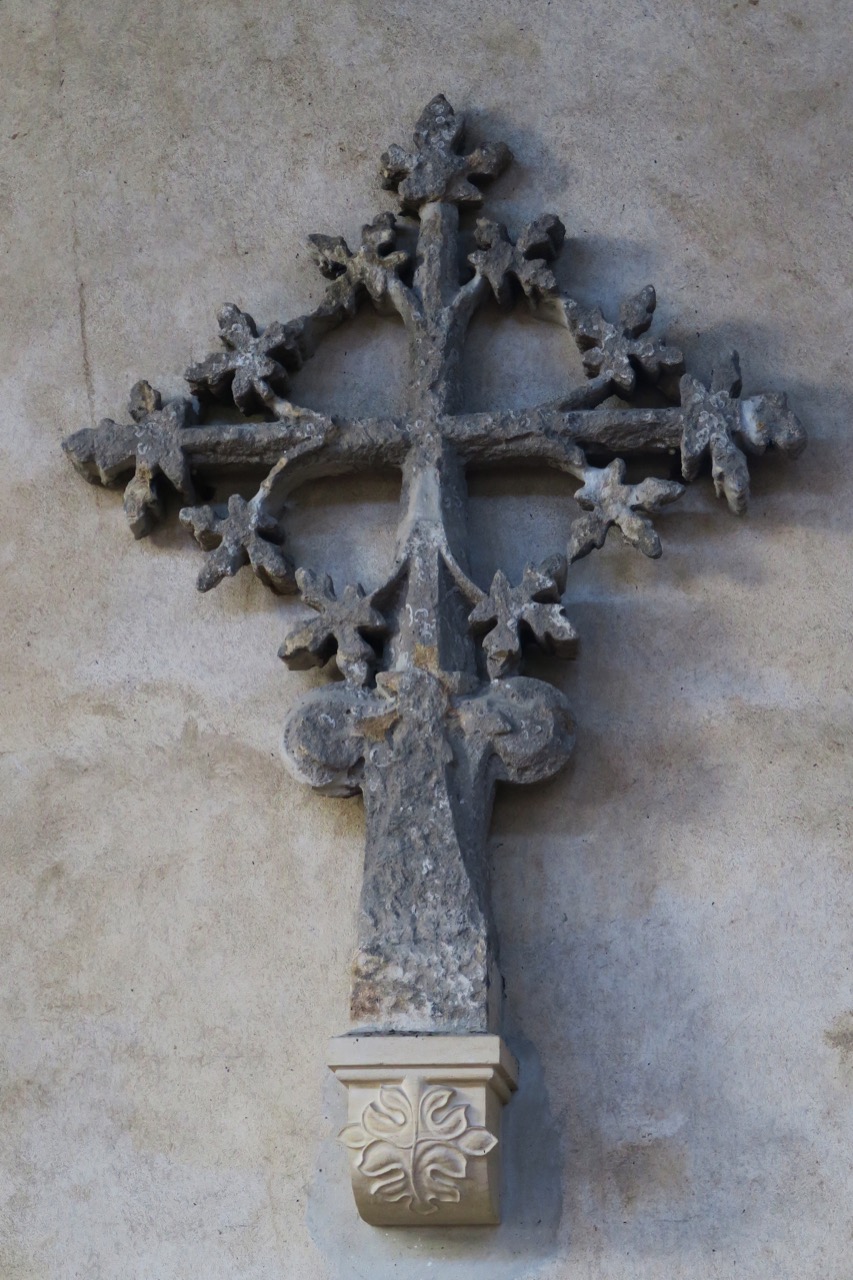 Stone cross on the north aisle wall