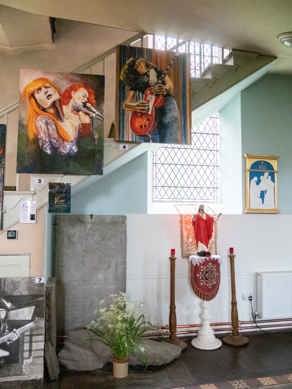 Exposition of paintings by “Vladimir”, a British artist, on the occasion of the 2019 Hay Festival, surrounding a 14th cent. tomb slab