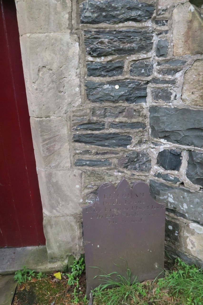 Rough stones of blue slate in the church wall