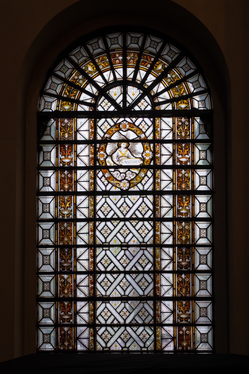 Stained glass window of St Matthew’s symbol, an angel