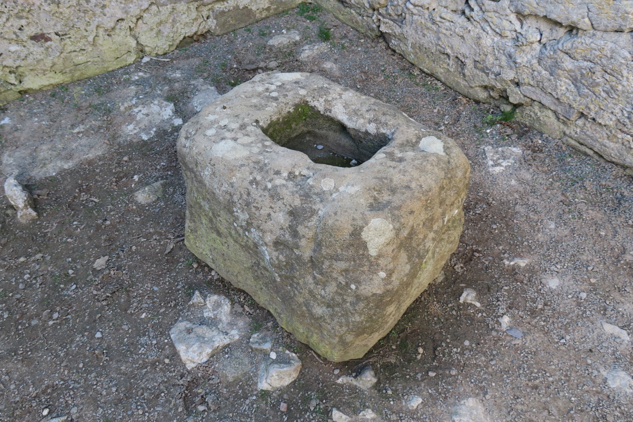Stone in the north west corner, possibly the base of a churchyard cross