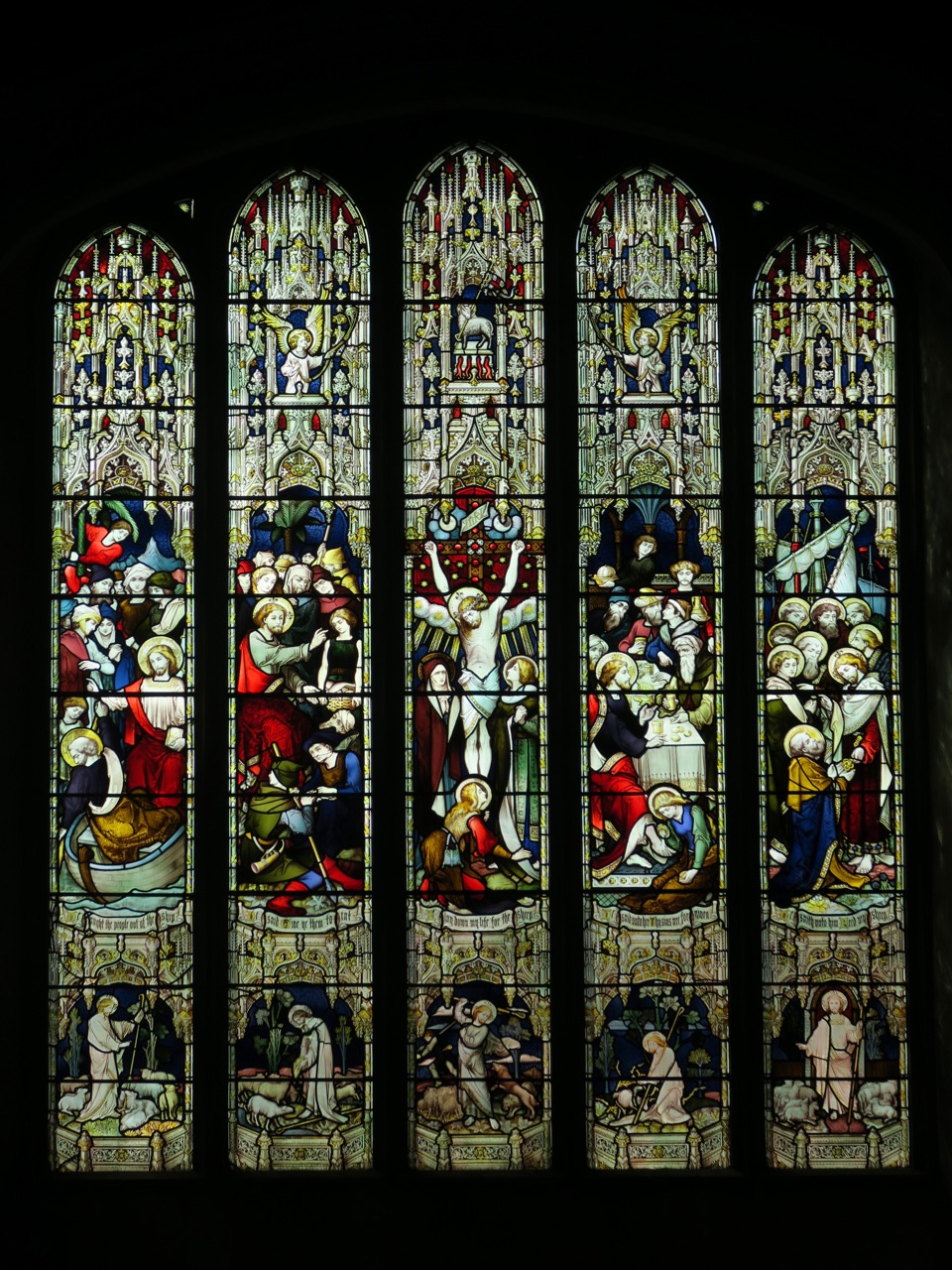 Stained glass window showing scenes from the Gospel