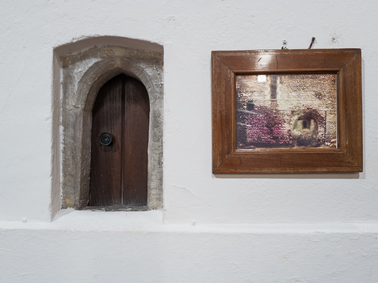 Anchorite’s cell (next to the window a photo of its discovery in 1884)